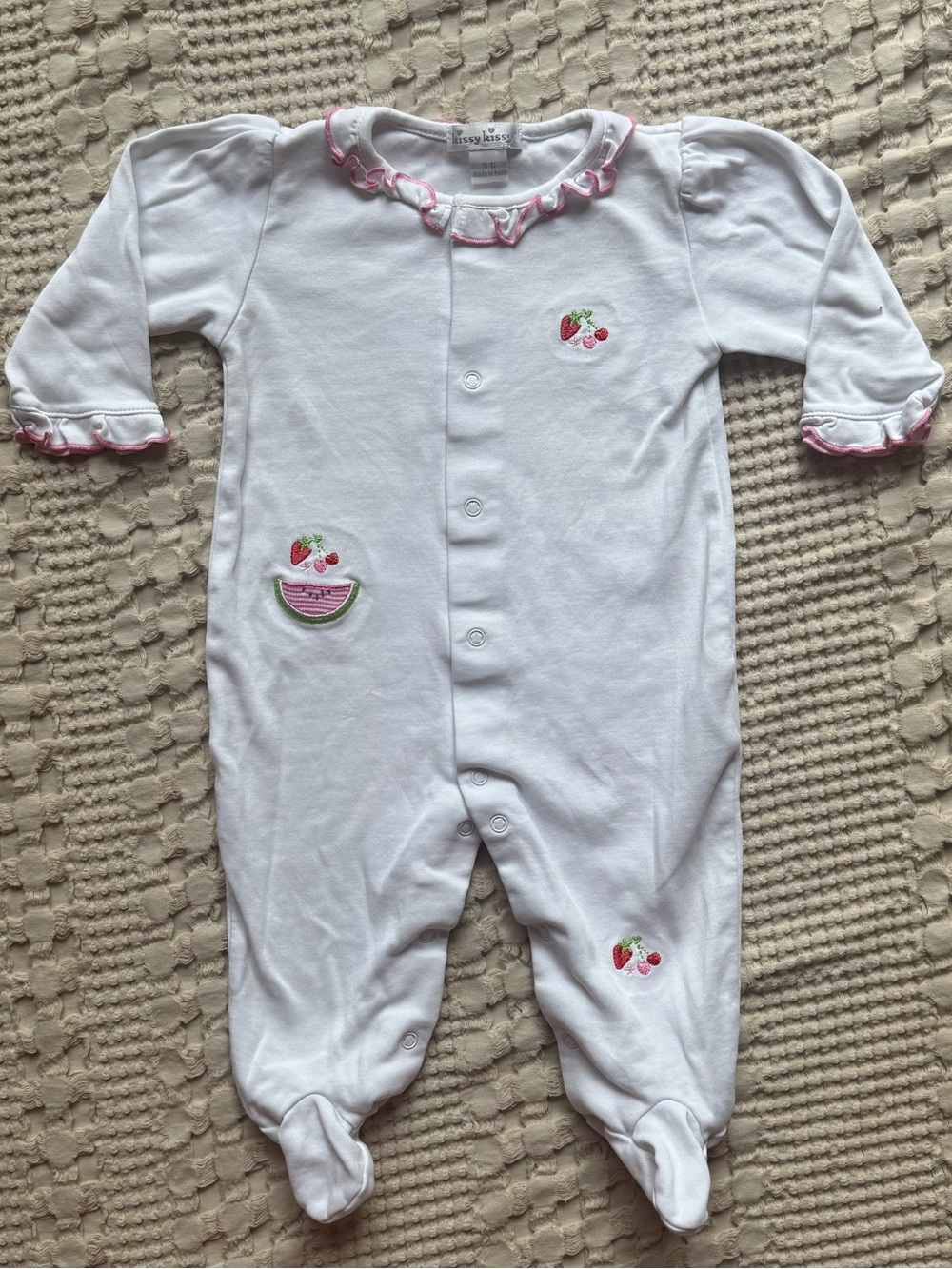 Kissy Kissy White Footed One-Piece with Pink Ruffle Trim and Fruit Embroidery